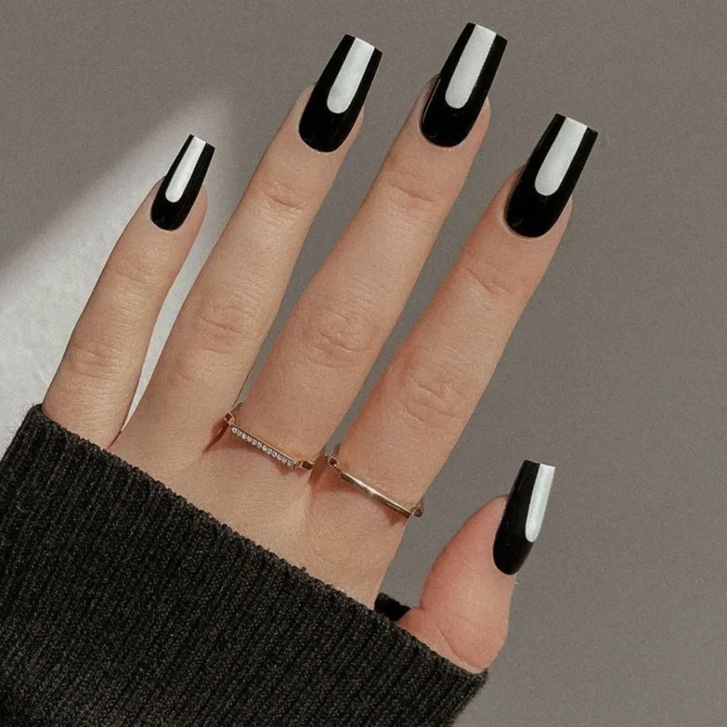   Nails with a sporty black and white design