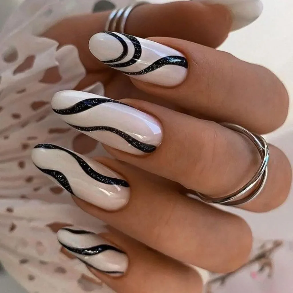   Nails with fancy black and white design