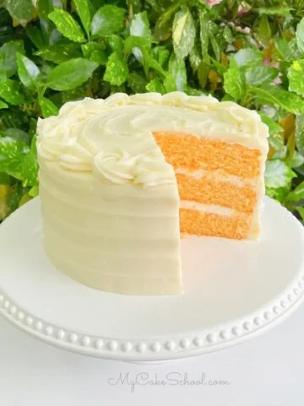 Orange Cake, sliced on a pedestal؛ کیک پاند بادام و Raspberry